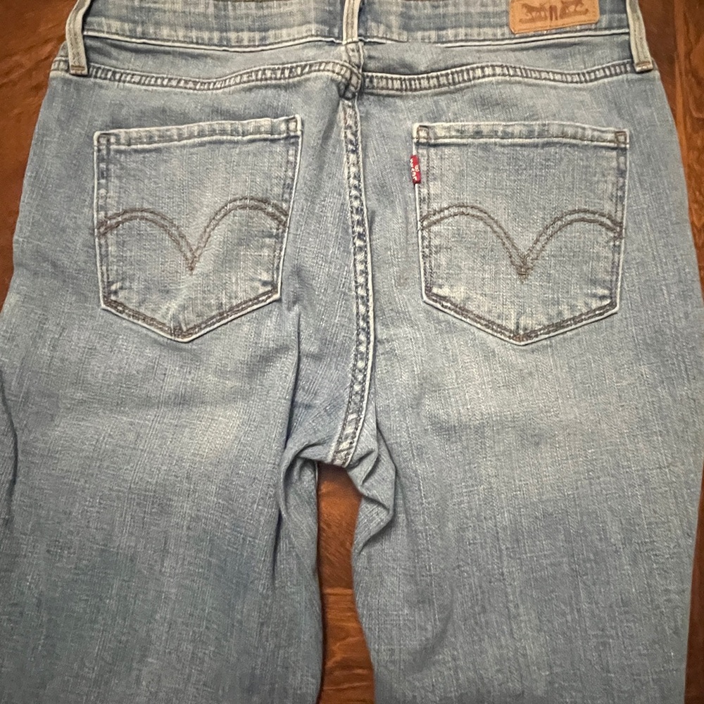 Levi's Blue Denim Jeans with Patterned Waistband, fits like 8